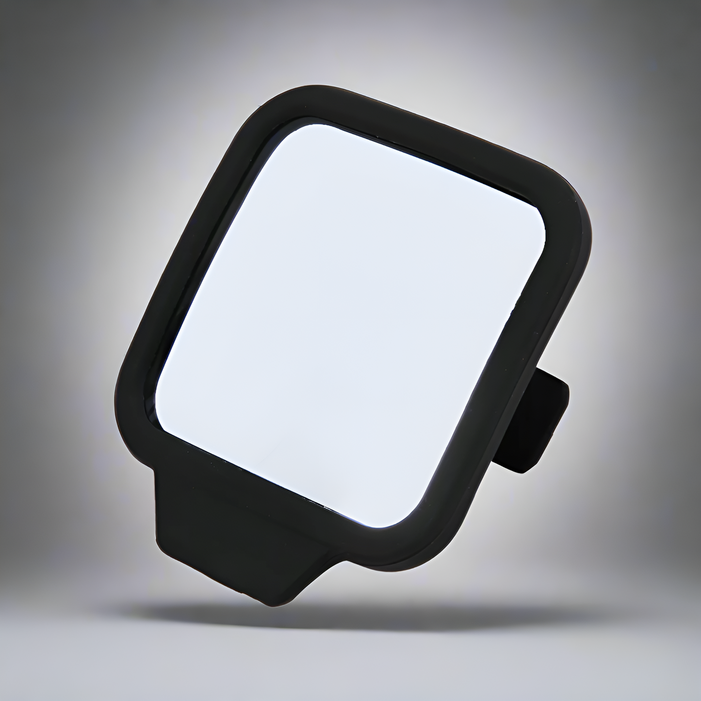 Black square mirror with rounded edges on a gray background