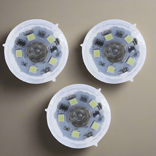Three LED light bulbs with a beige background