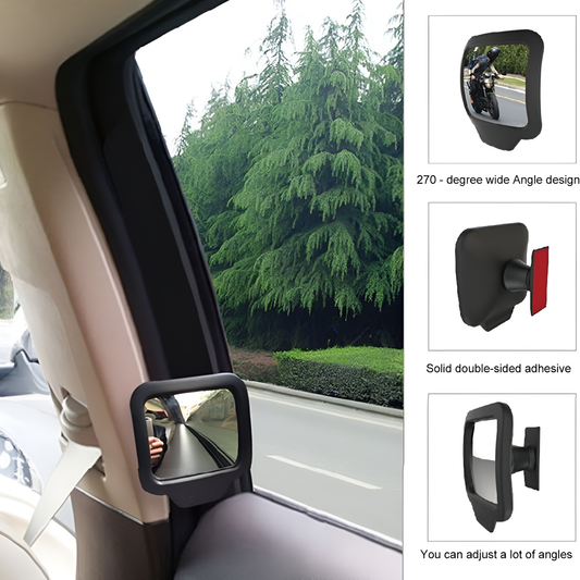 Car side mirror with adjustable design inside a vehicle, showing a view of trees outside.