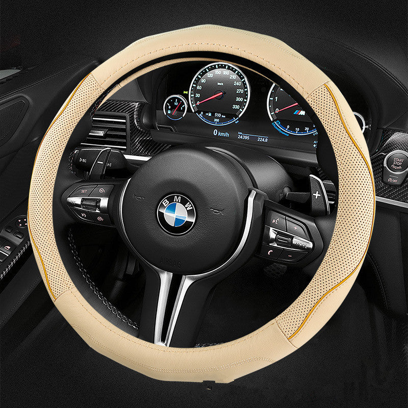 Steering wheel with beige cover and BMW logo in a car interior